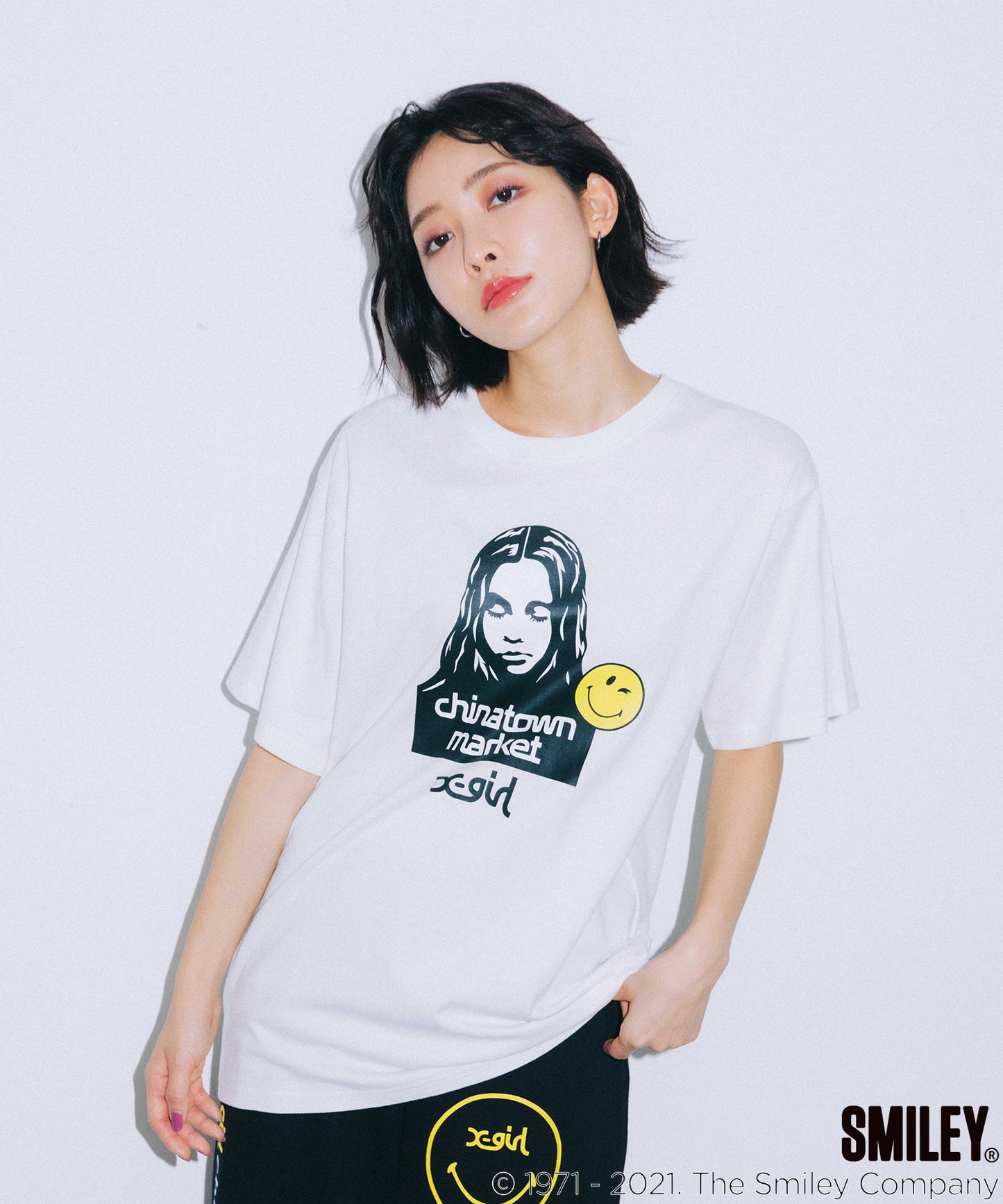 X-girl × CHINATOWN MARKET WINKY FACE S/S TEE